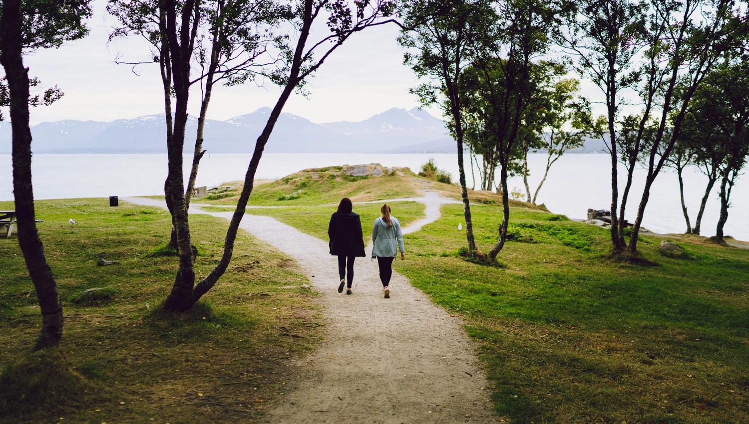 two people walking along the trails