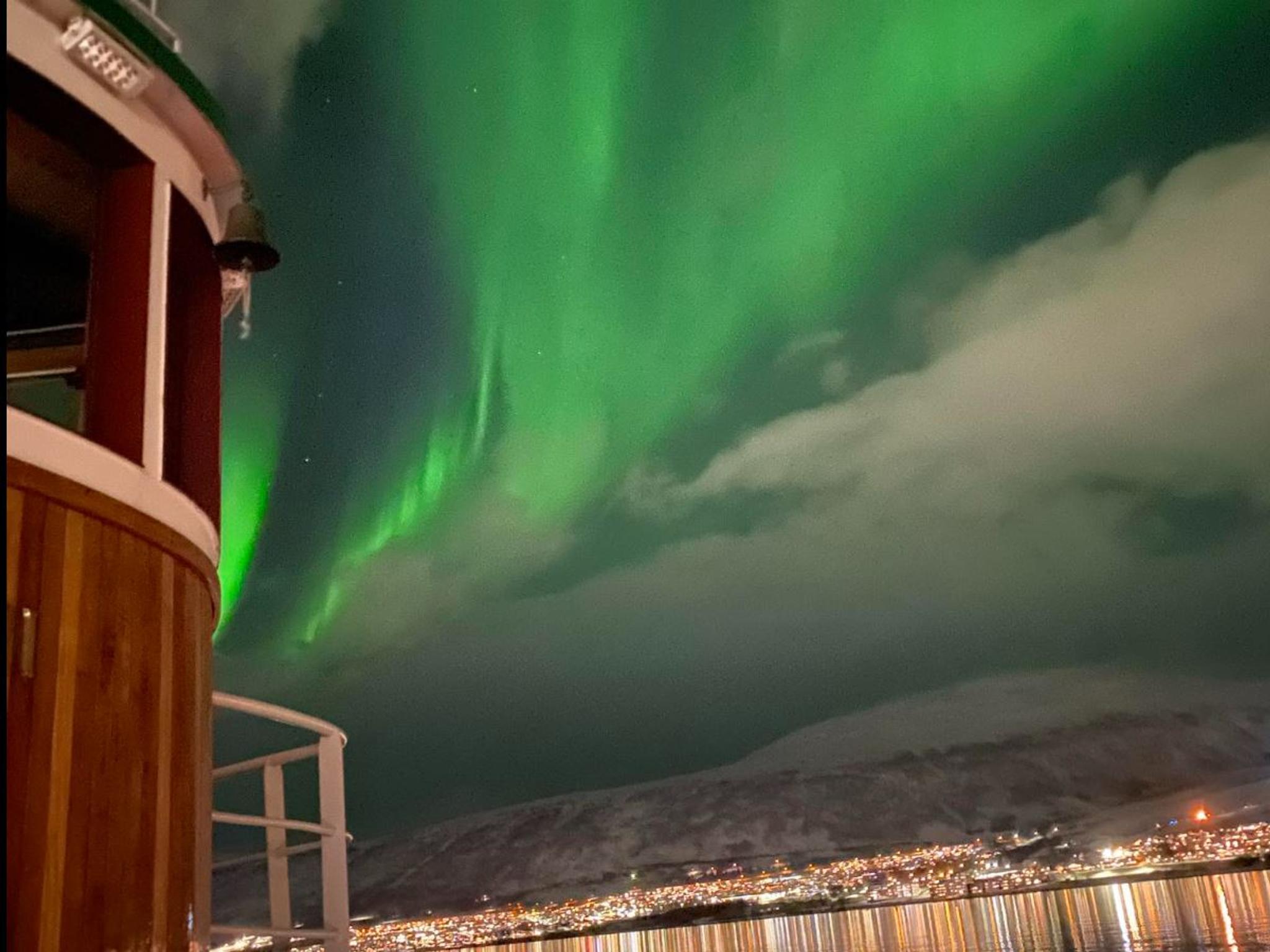 The northern lights peaking through the clouds