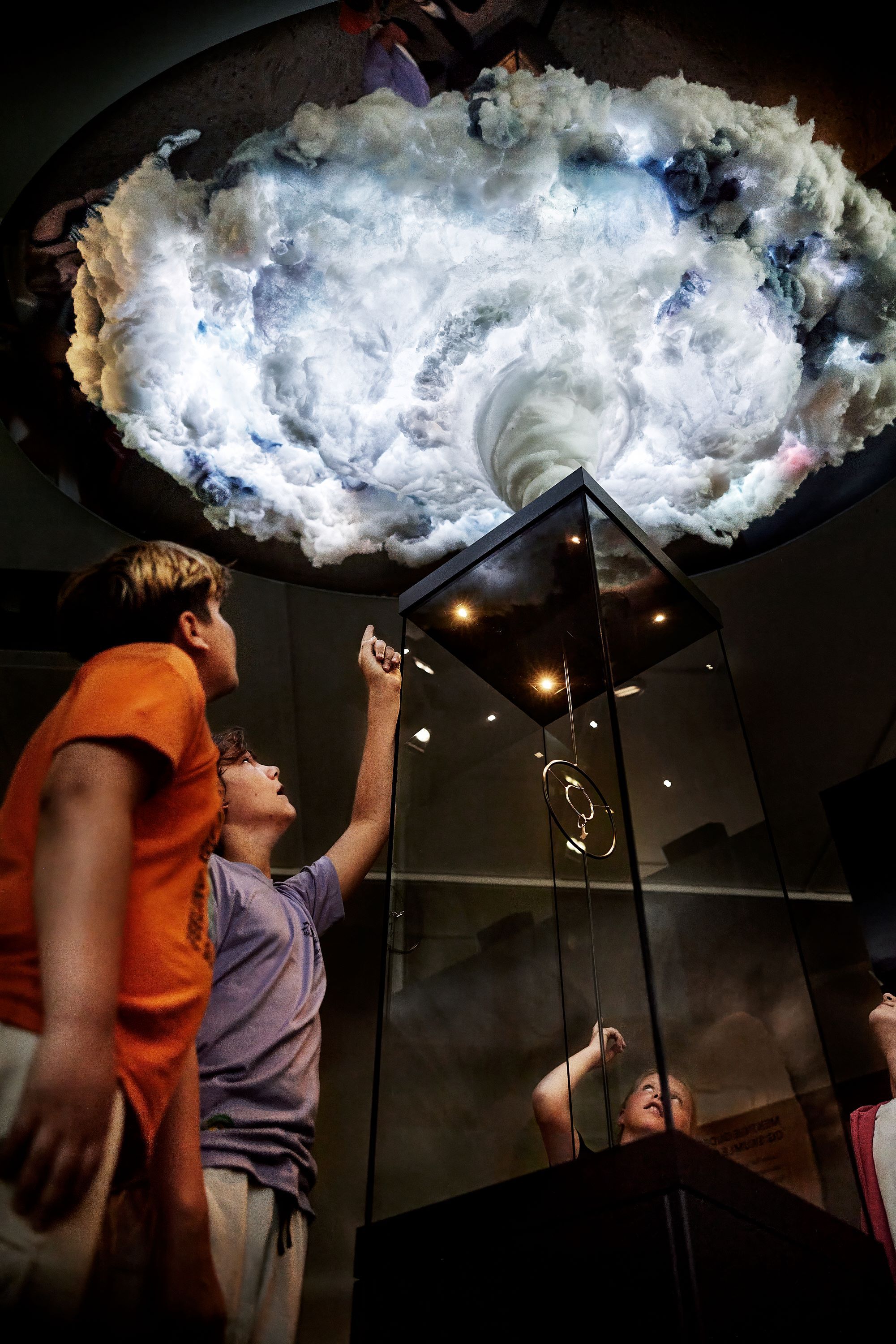 Two children lookign at an installation on display