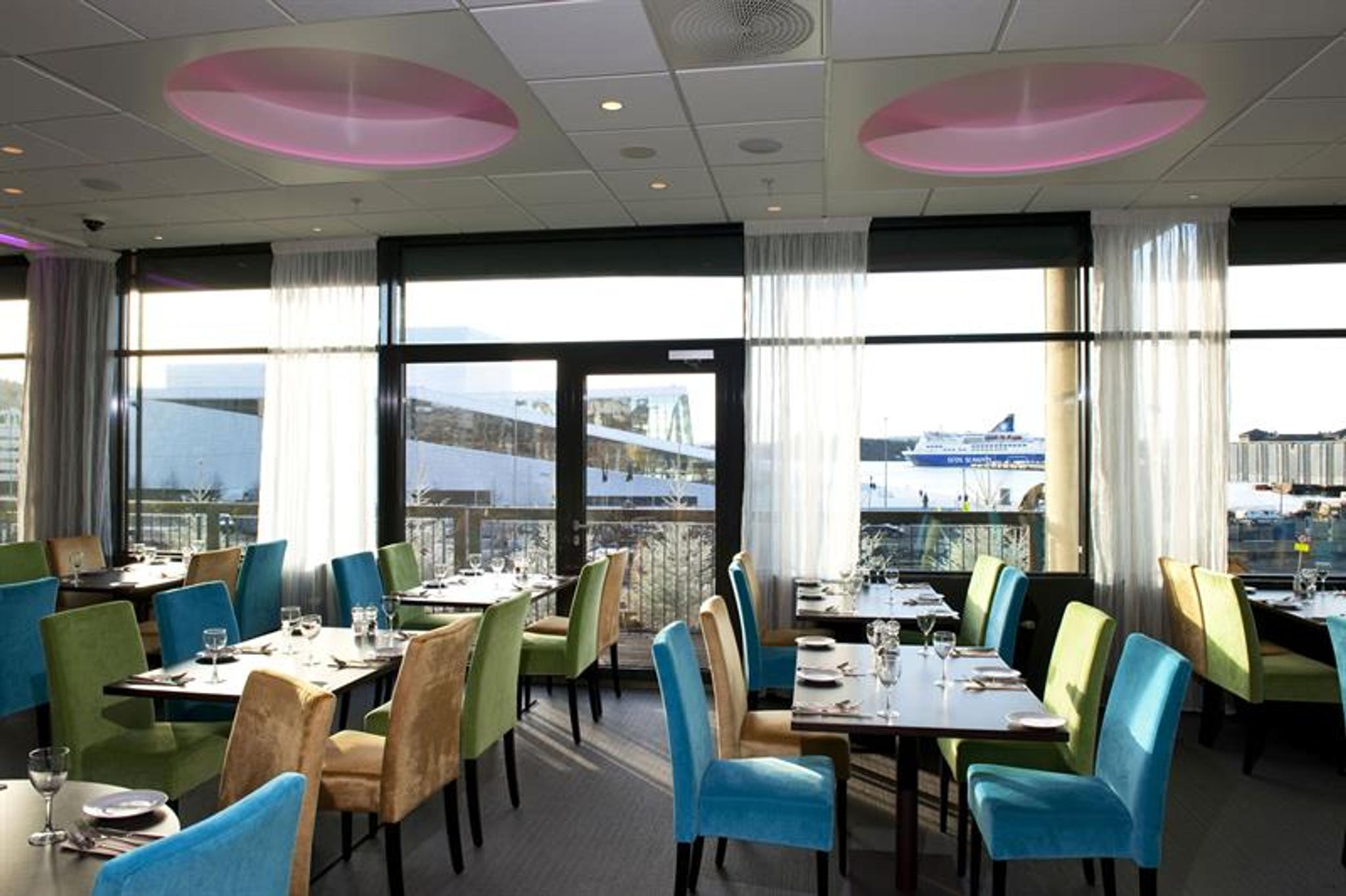 bright restaurant with a view of the opera house
