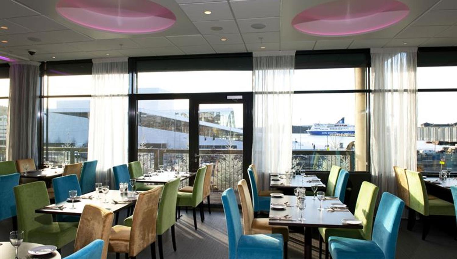 bright restaurant with a view of the opera house