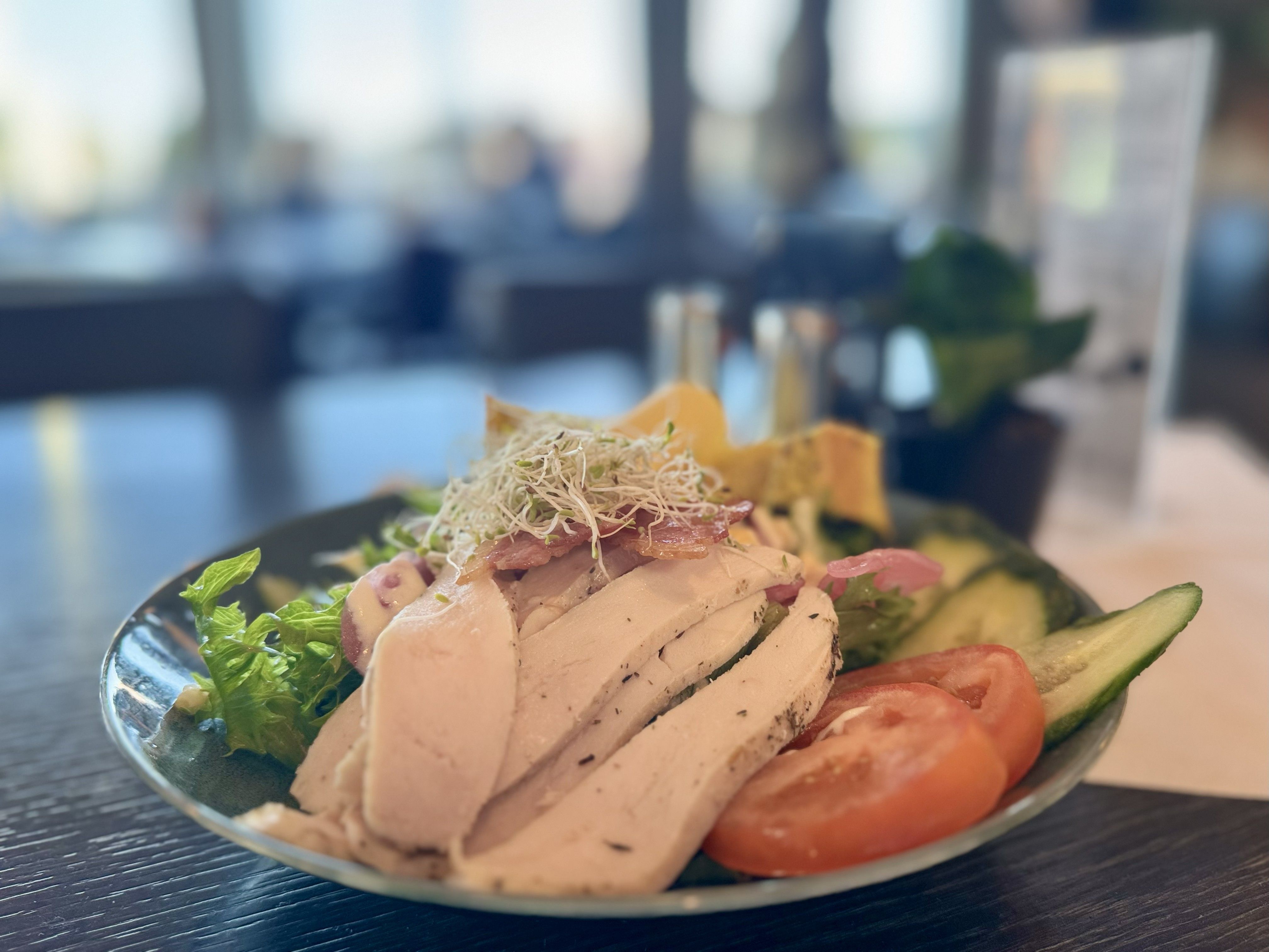 Chicken salad with cucumber, tomato, sprouts, and lots of delicious ingredients.

