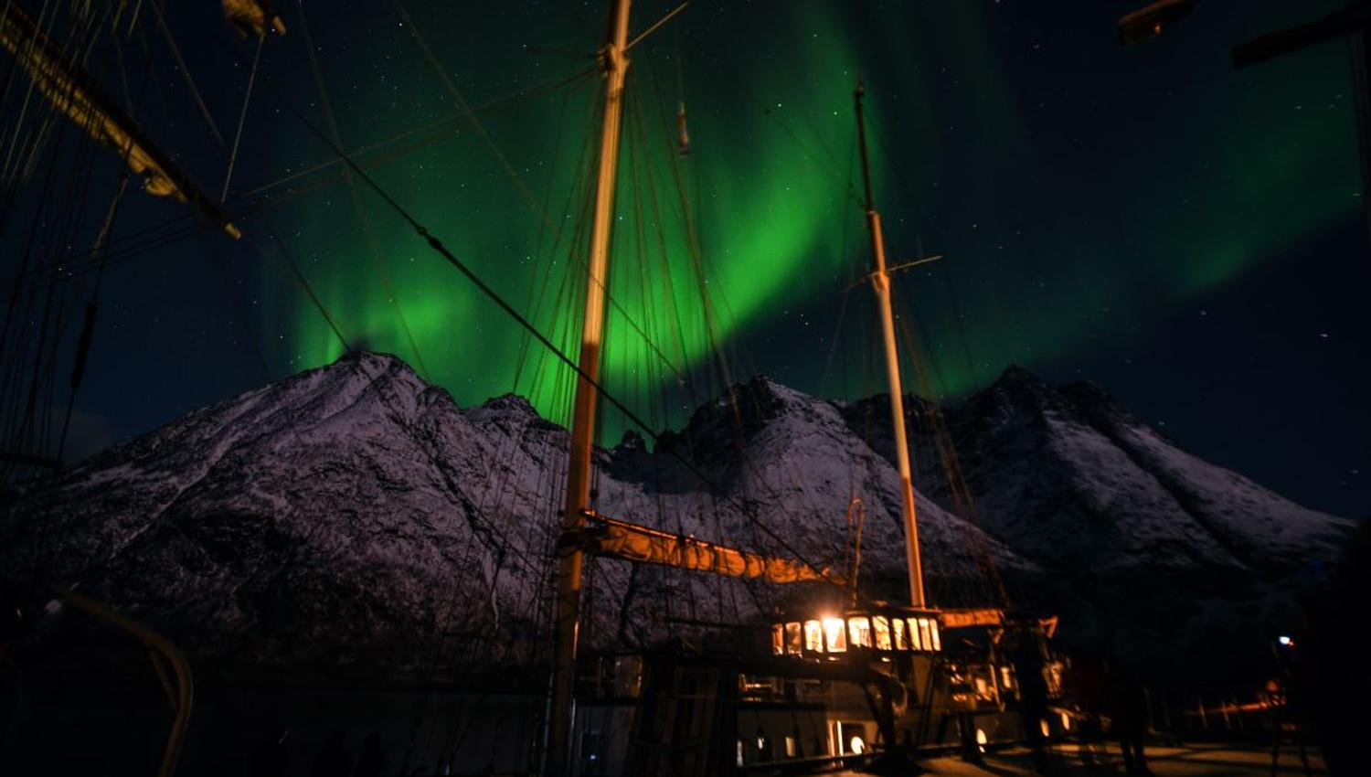 Northern Lights over the sailing boat