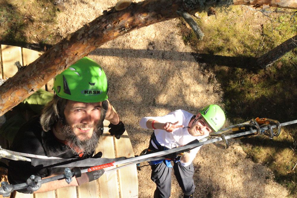 2 boys climbing on the climbing park High and Low in Bø in Telemark 