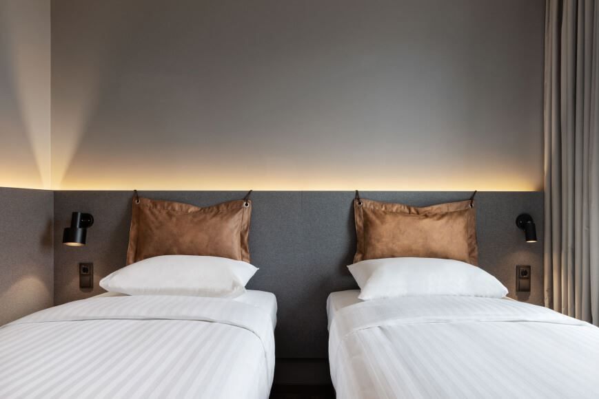 Bedroom with two beds at Moxy hotel.