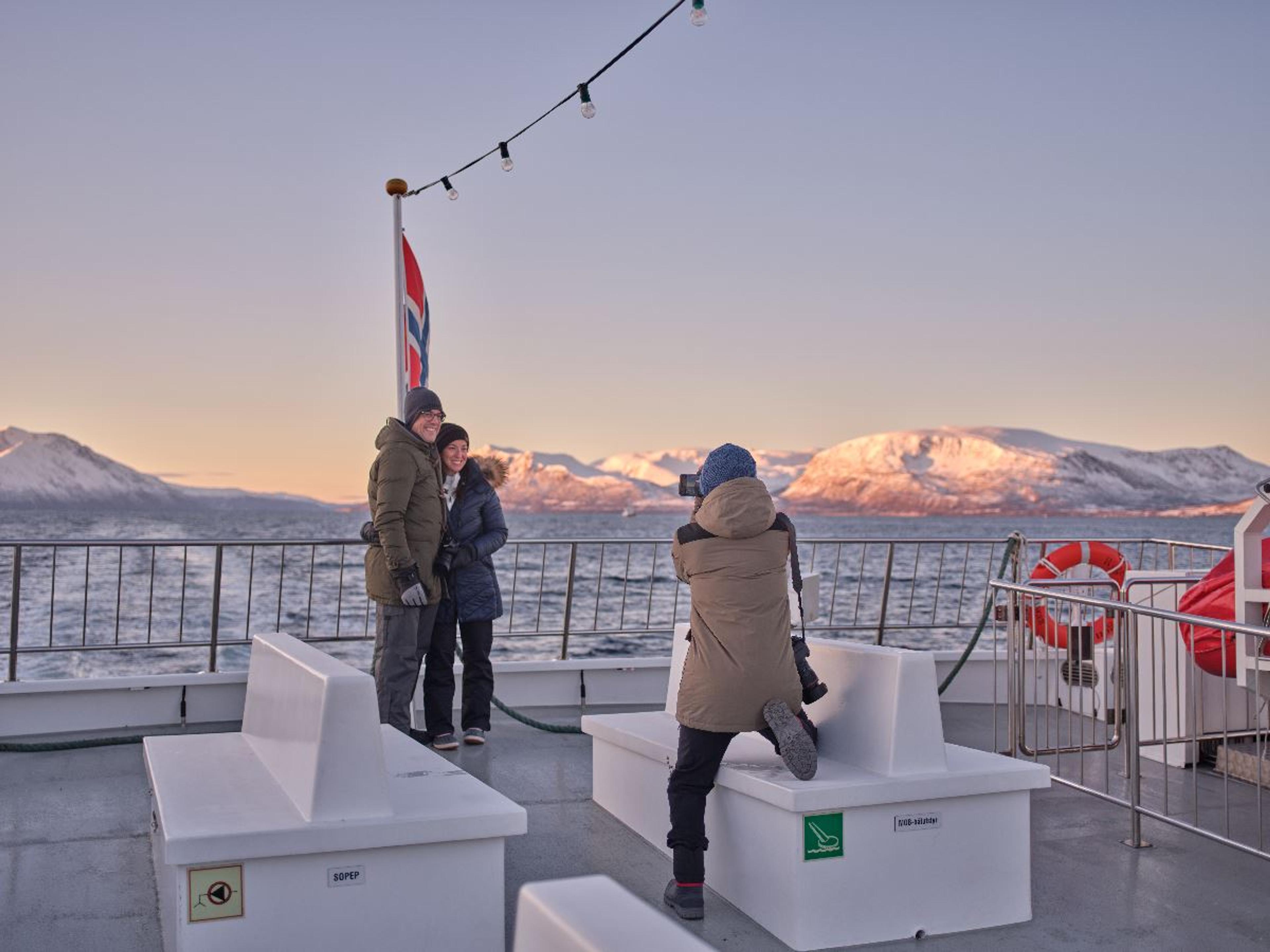 Photographing a couple on the deck of a boat