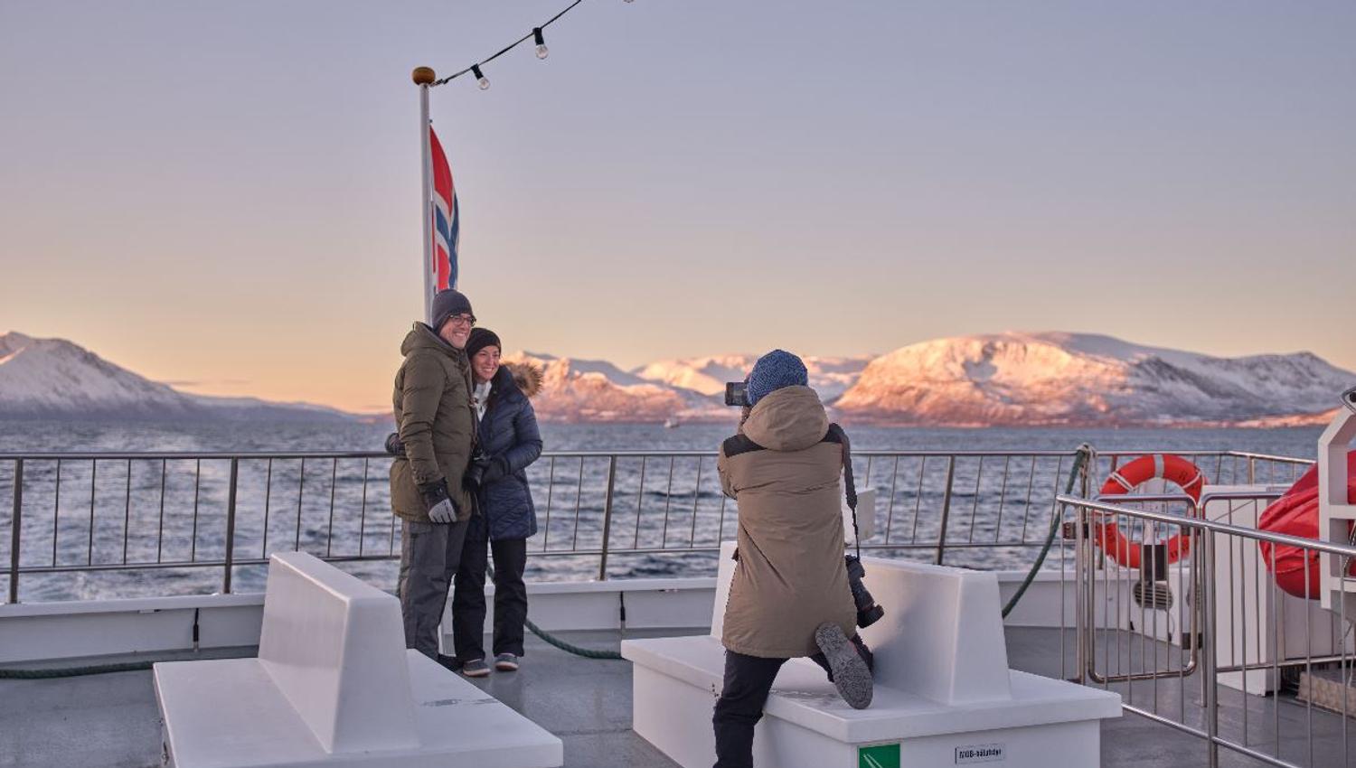 Photographing a couple on the deck of a boat