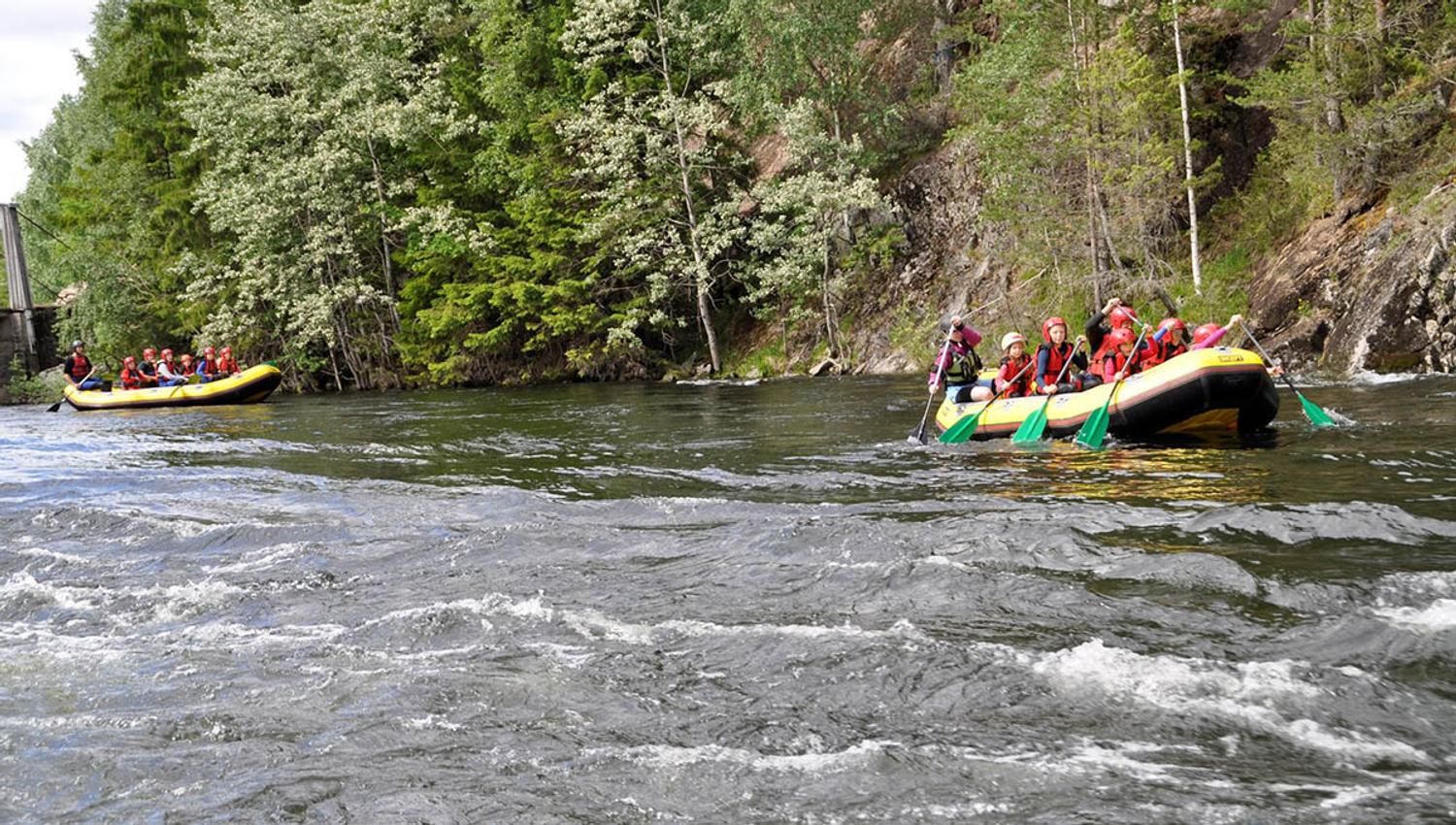 Two yellow rafts on a river