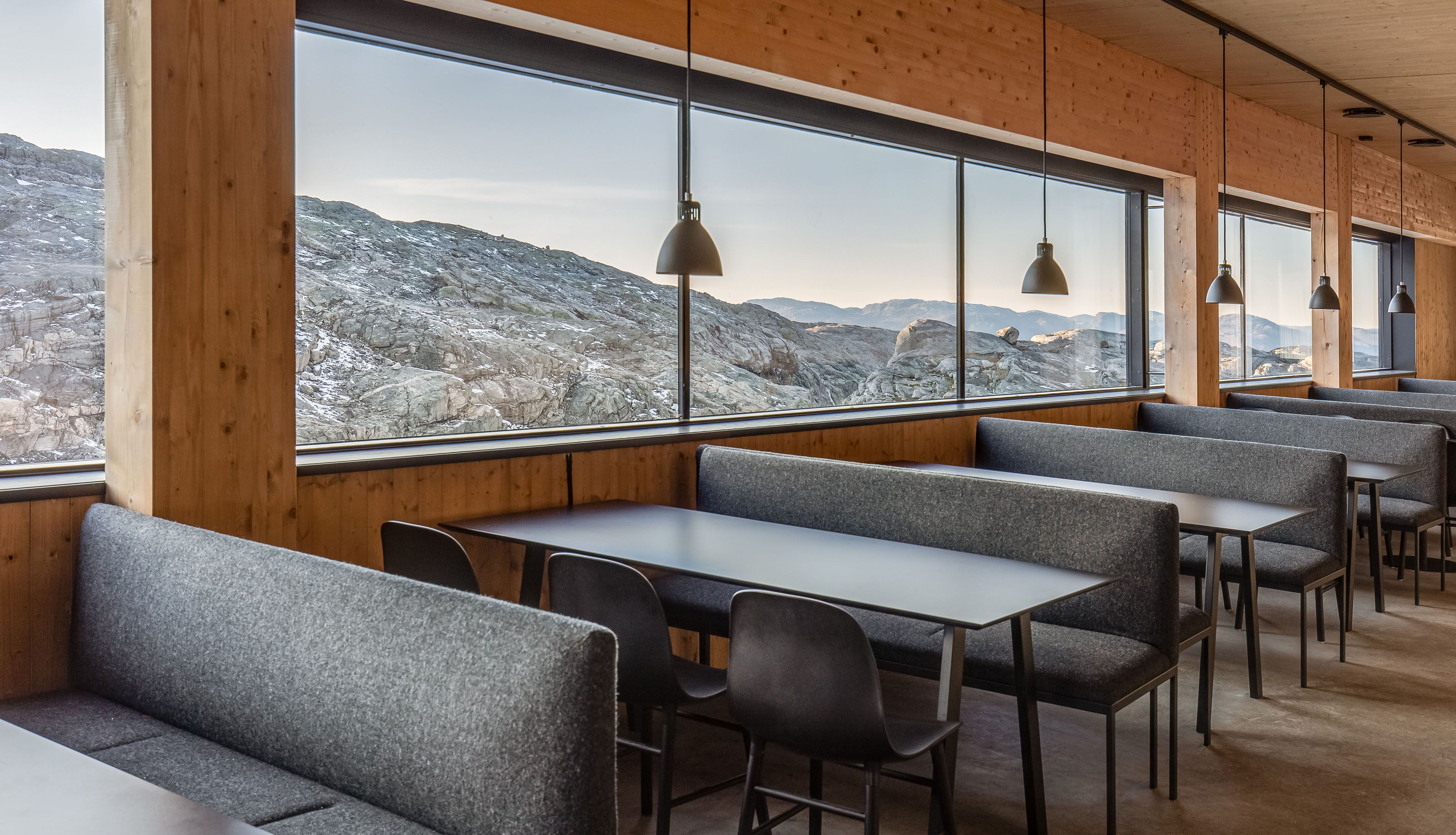 Restaurant at Fonna1199 with large windows and views of Hardanger's dramatic mountain formations
