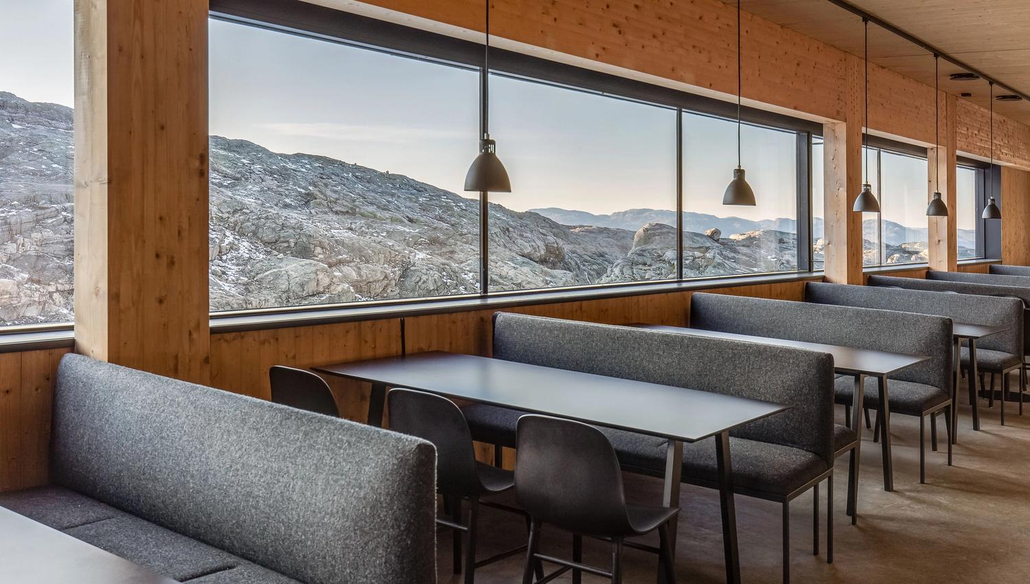 Restaurant at Fonna1199 with large windows and views of Hardanger's dramatic mountain formations