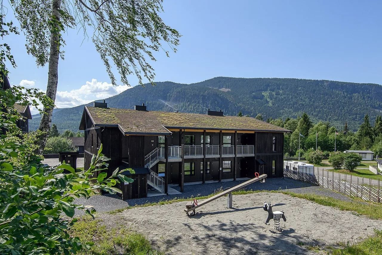 Hafjelltunet with a playground in front of it.