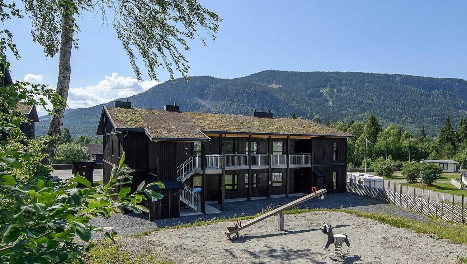 Hafjelltunet with a playground in front of it.