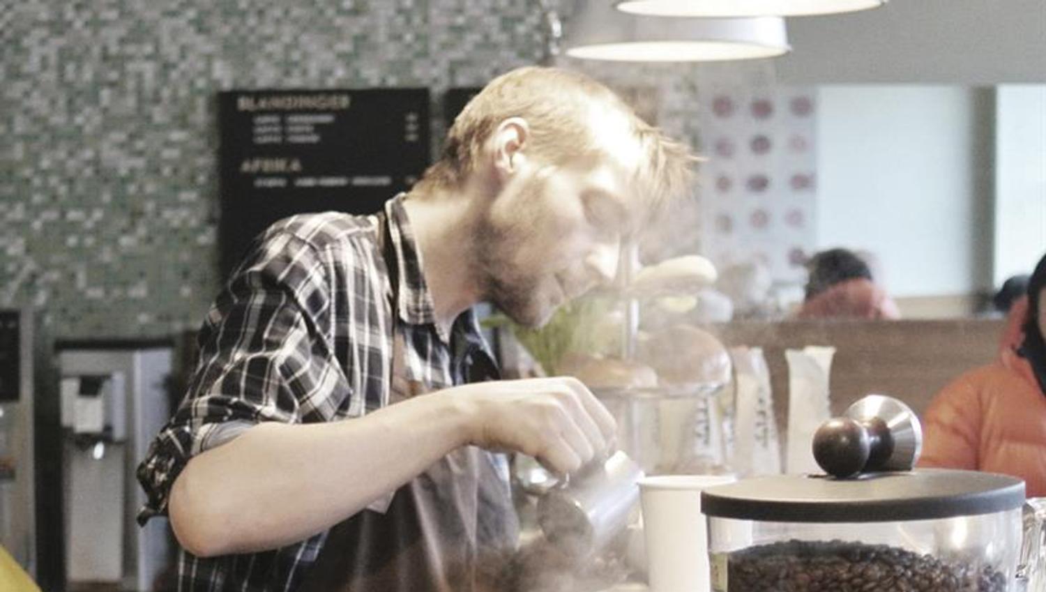 Barista making coffee.