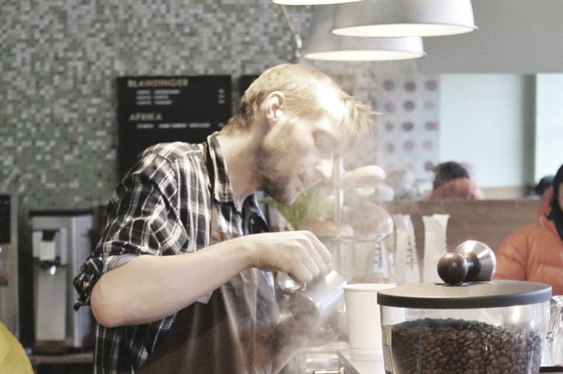 Barista making coffee.