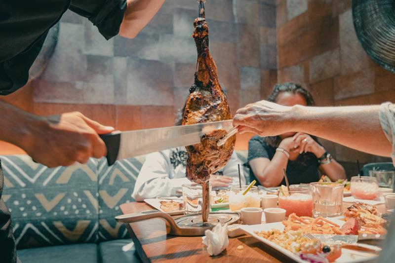 Meat is cut at the table