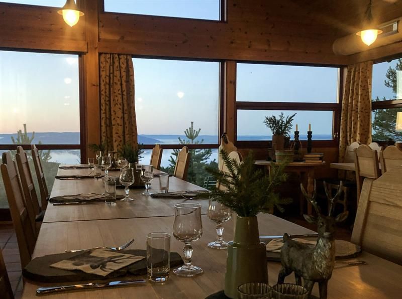 Dinner table with view over the water at Ringkollstuen