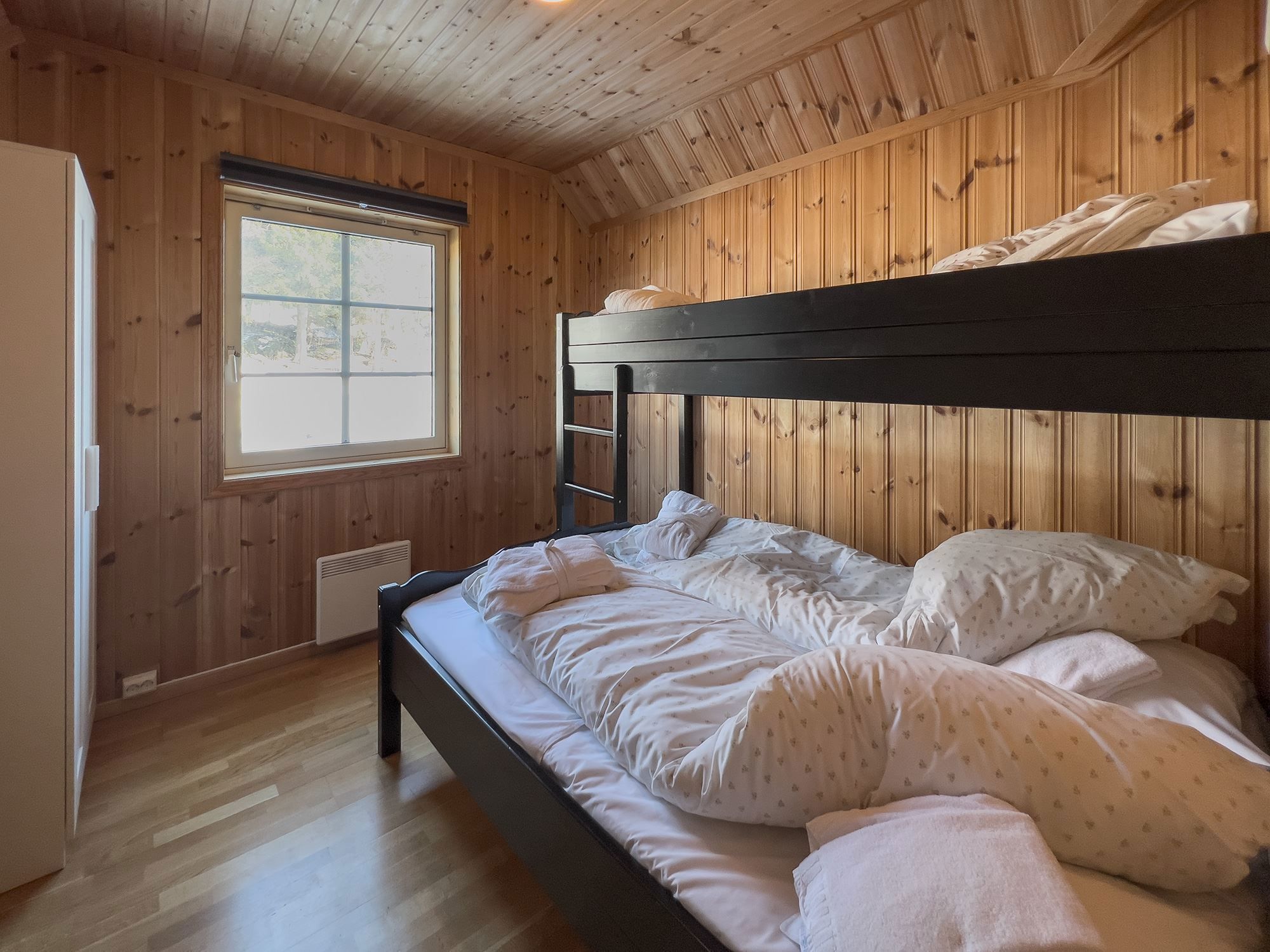 A bunk bed in a room.