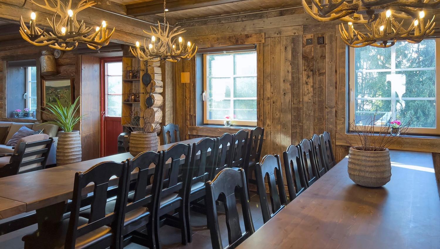 A room with a table and chairs.