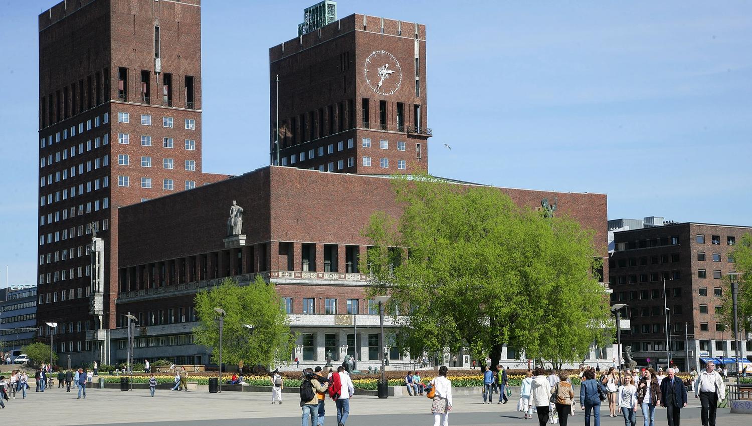 oslo town hall seen from the oslo fjord and town hall square