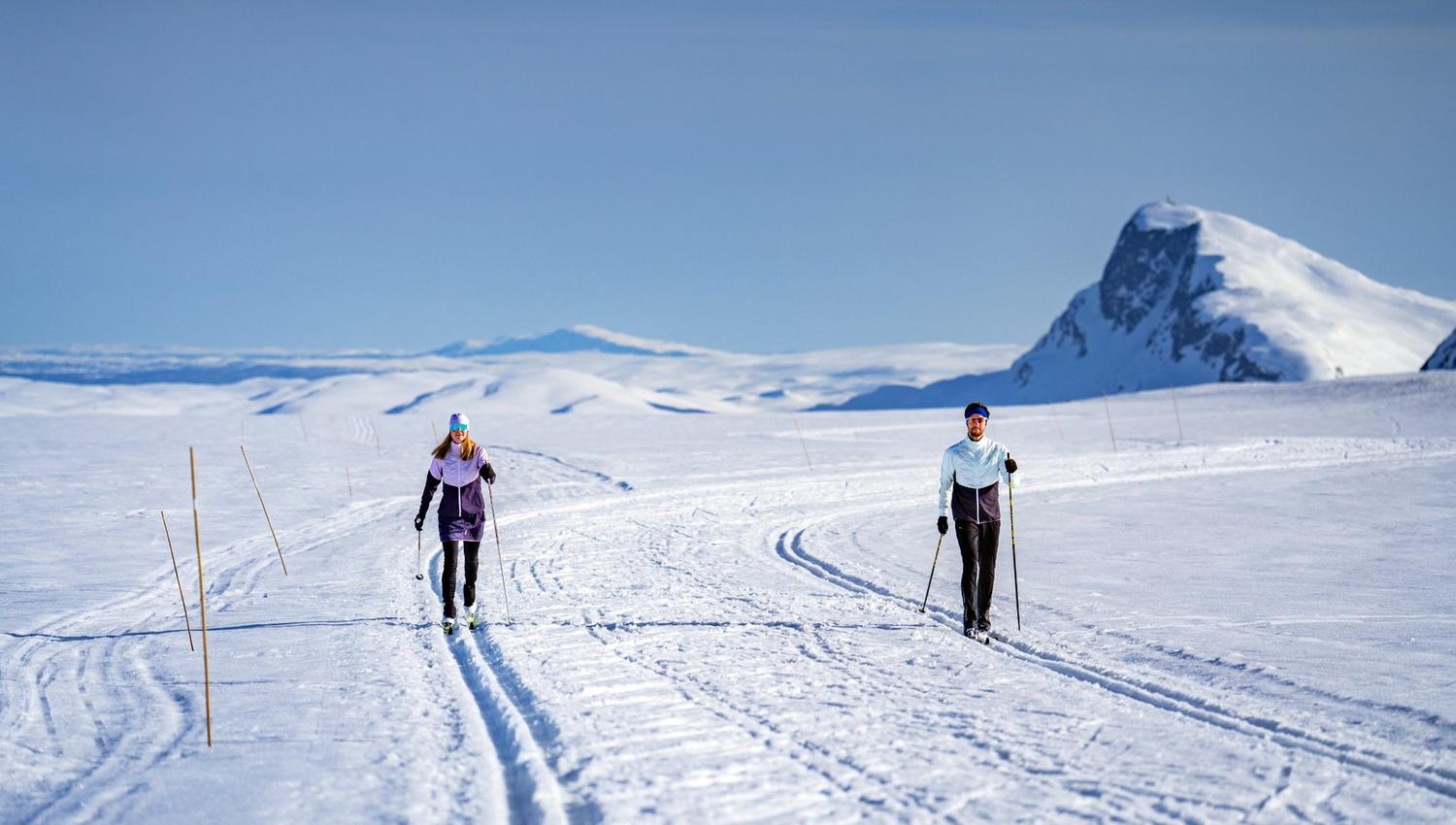 Two skiers in beautiful scenery in the mountains