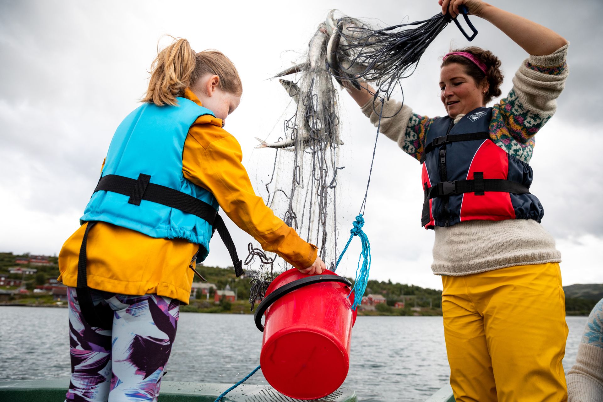 Hilde with child and their catch ( trout ). 