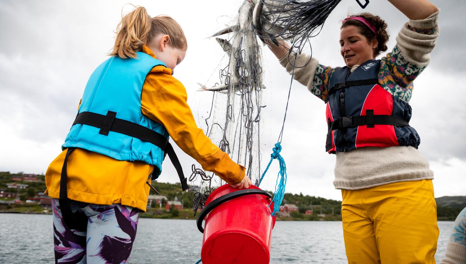 Hilde with child and their catch ( trout ).