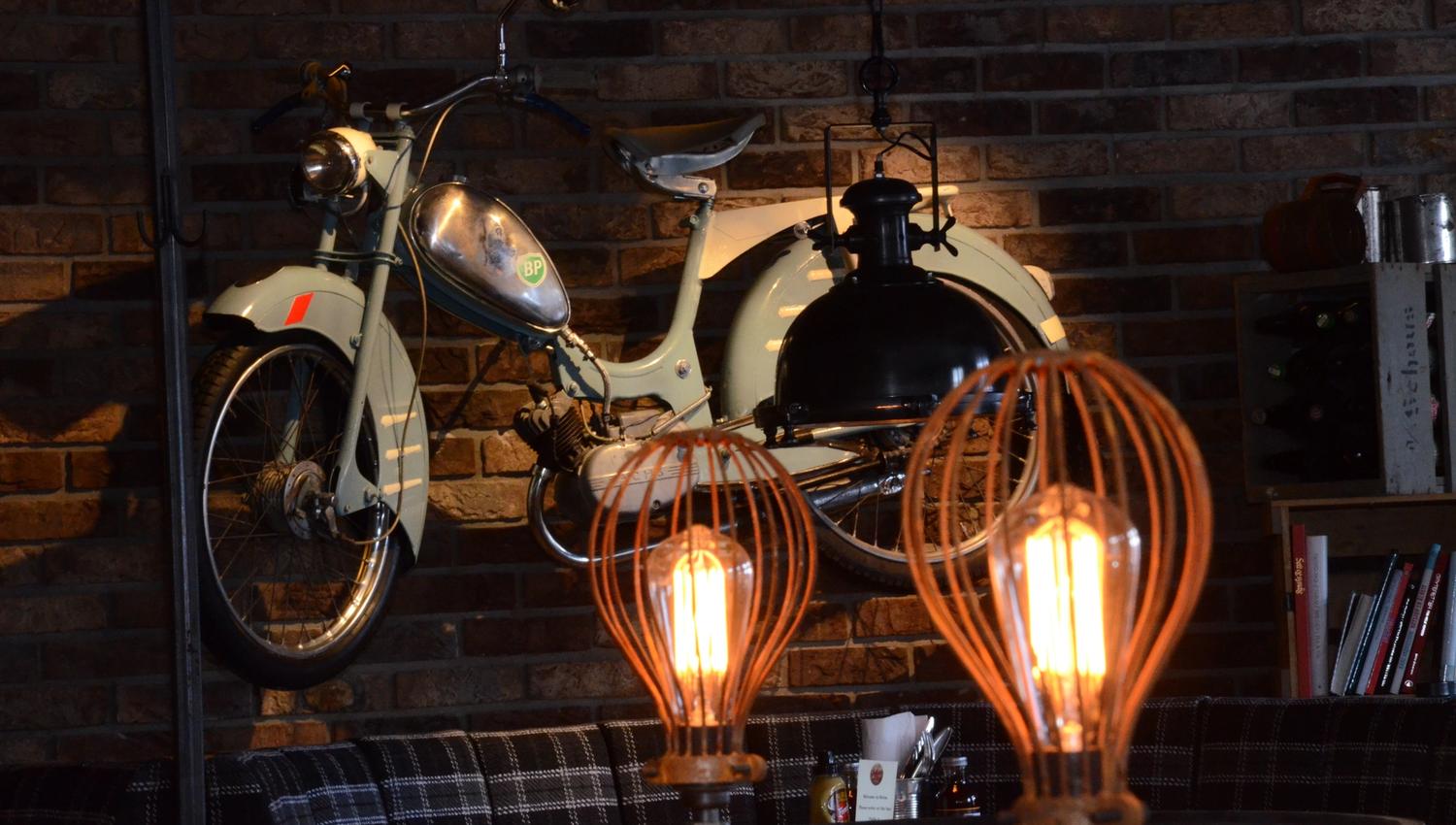 Motorcycle on the wall at Heim Gastropub