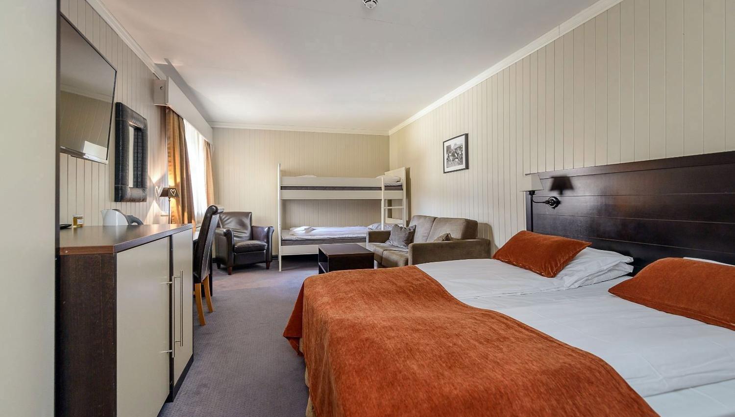 Junior suite with bed and bunk bed.