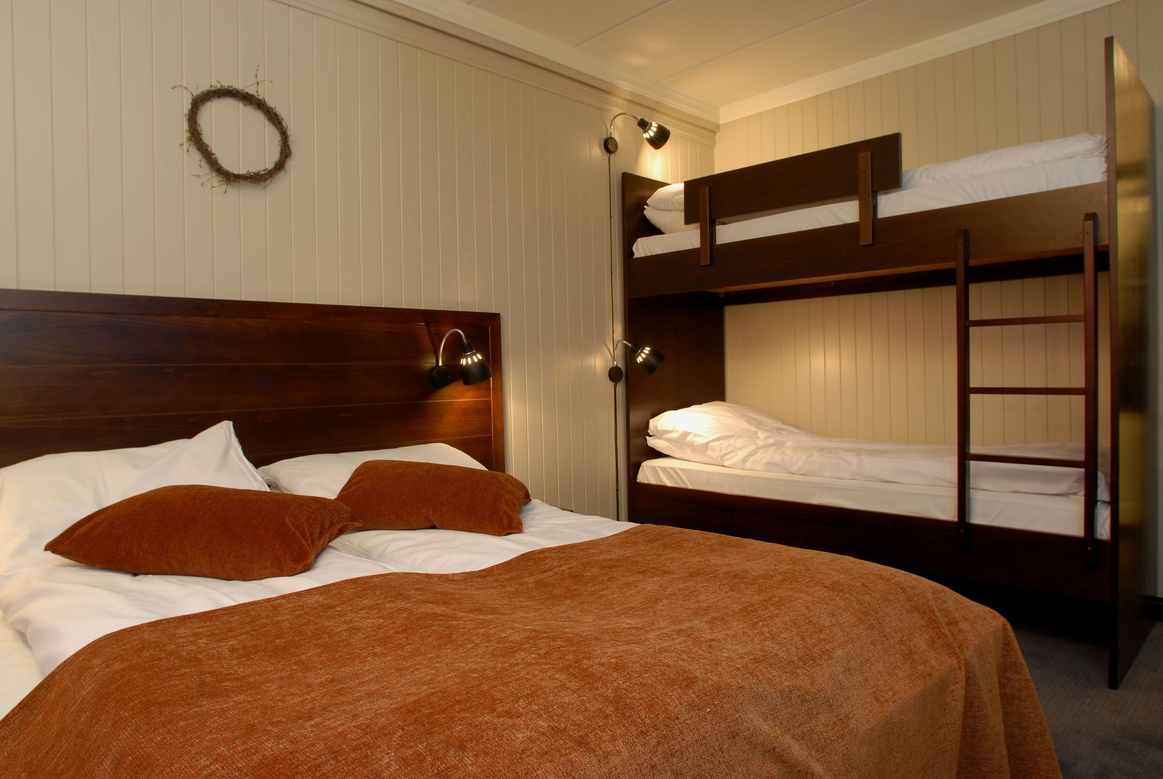 One bed with two bunk beds and a double bed