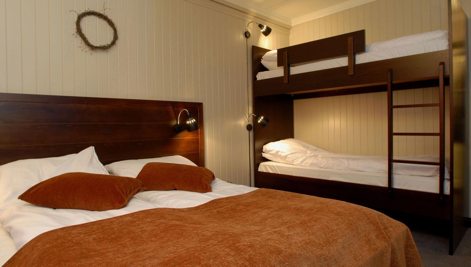 One bed with two bunk beds and a double bed