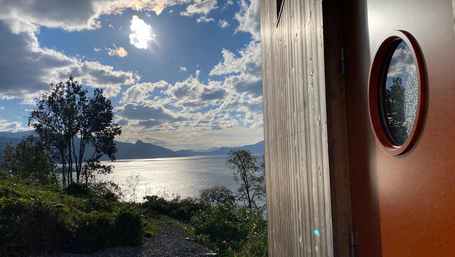 Sunny view from the cabin’s entrance over Hardangerfjord.