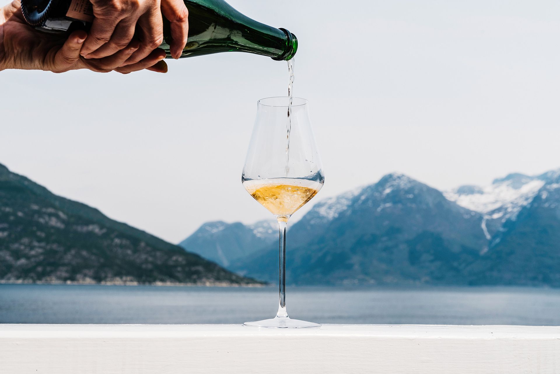 Enjoy a glass of sparkling wine with a spectacular view of the Hardangerfjord.