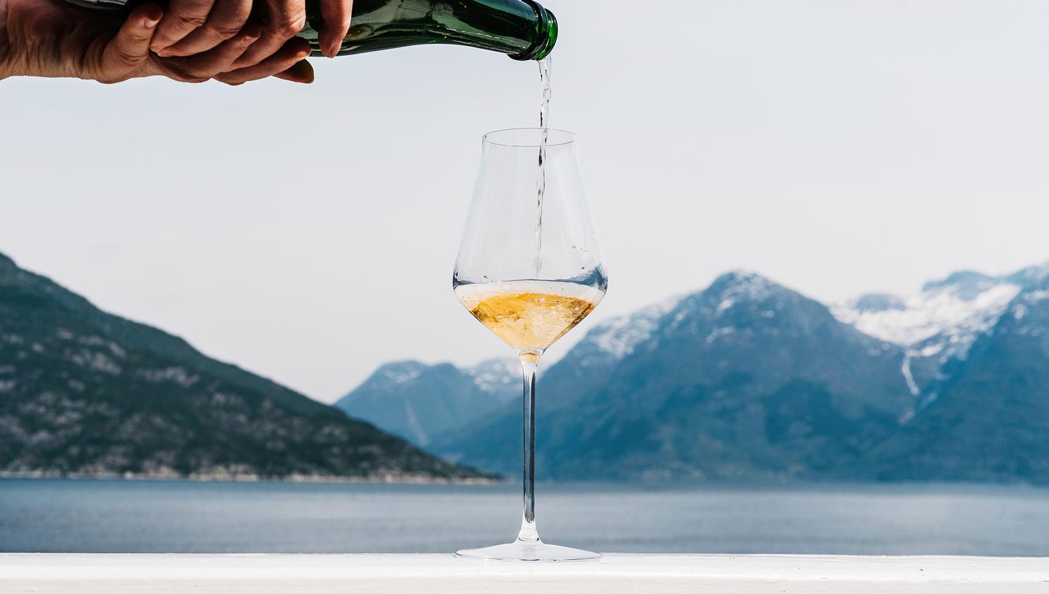 Enjoy a glass of sparkling wine with a spectacular view of the Hardangerfjord.