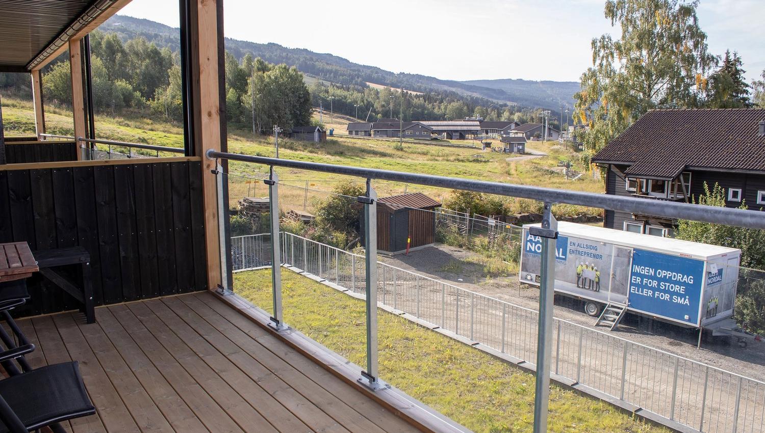 A balcony with railings and a view of Hafjell Bike Park