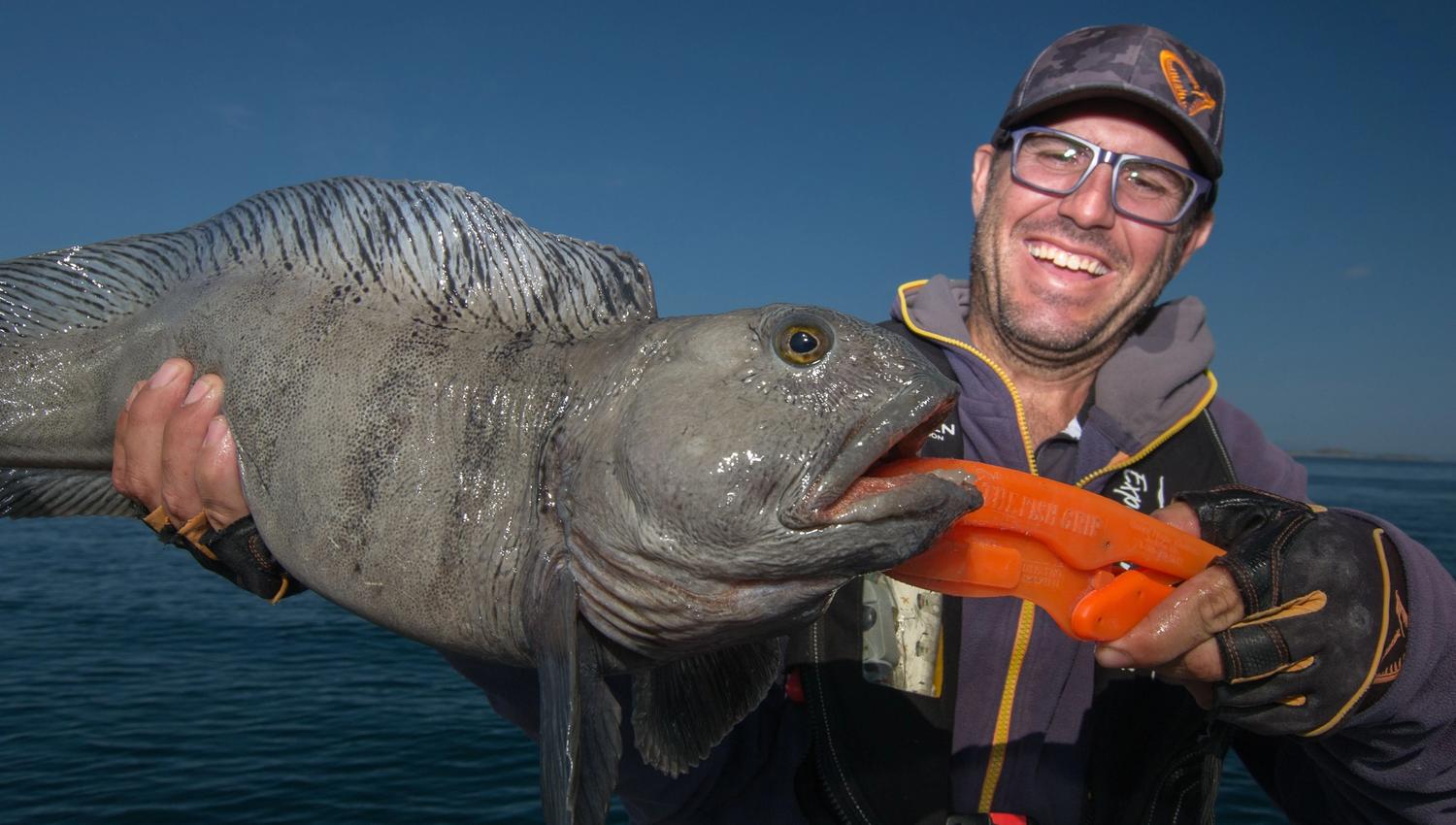 guest with a big fish on a fishing trip