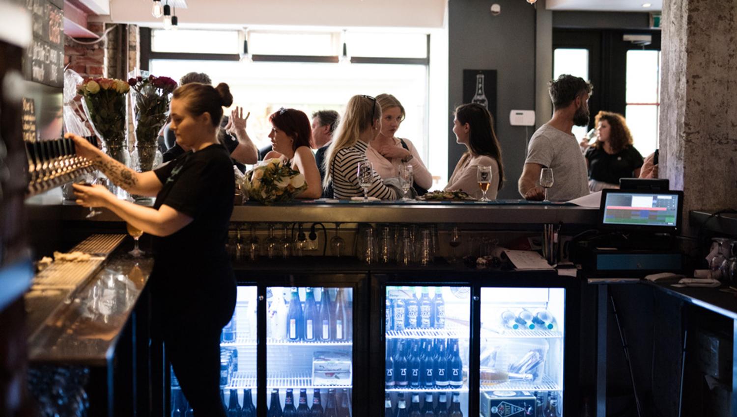 Bar area with lots of people.