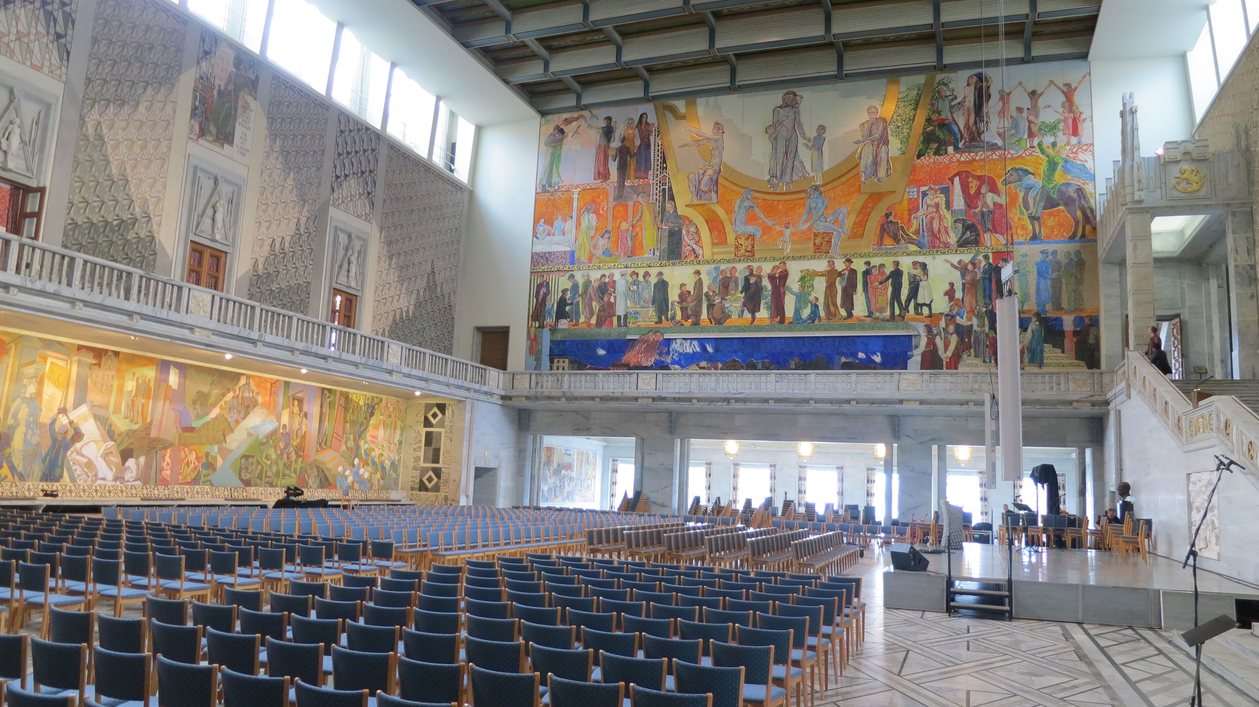 oslo city hall from the inside with stage and chairs