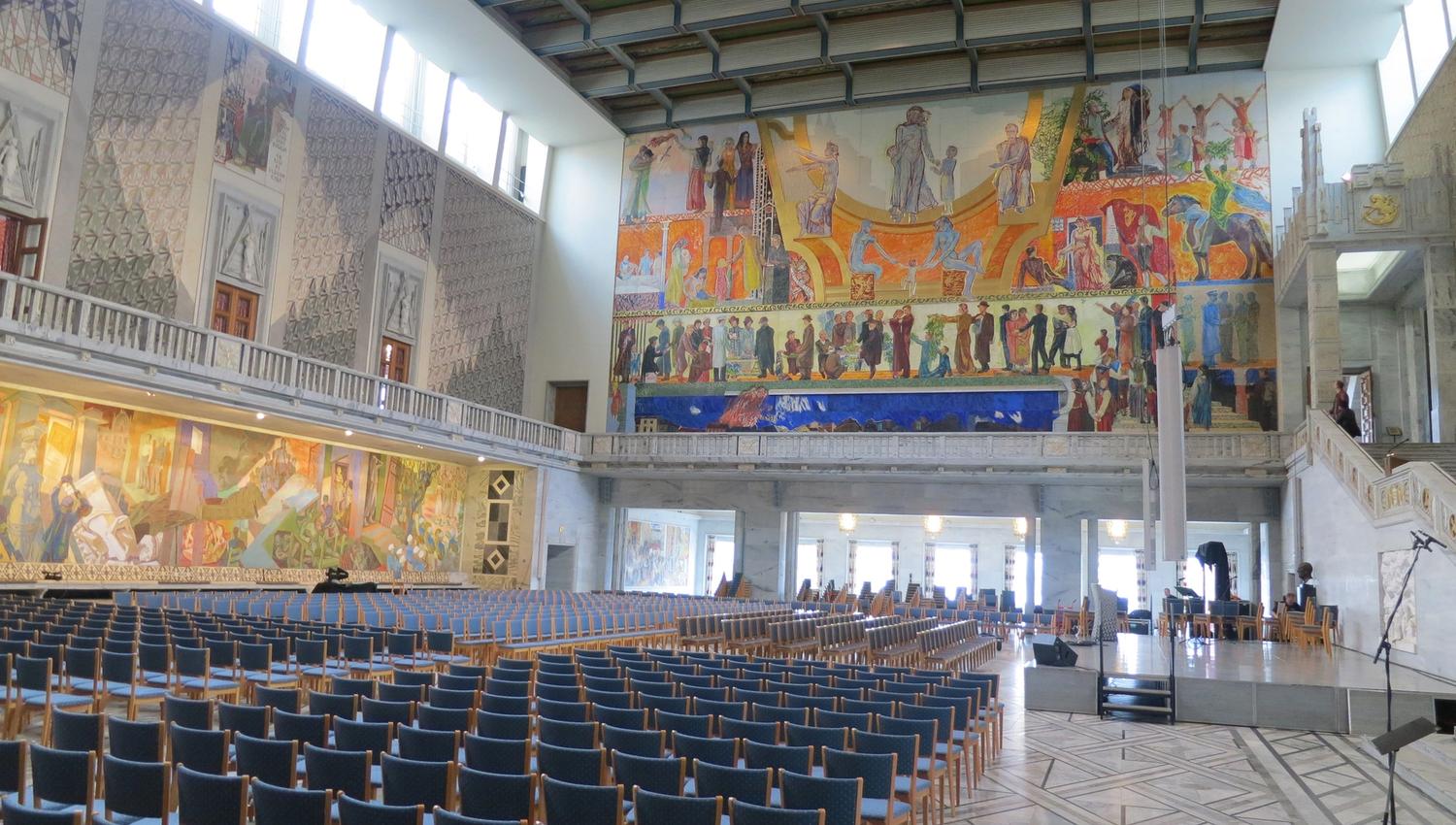 oslo city hall from the inside with stage and chairs