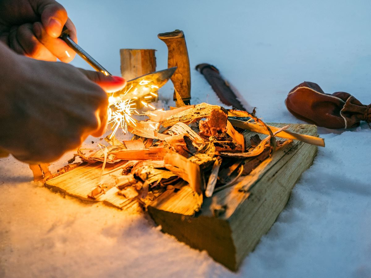 Demonstrating how to light the fire