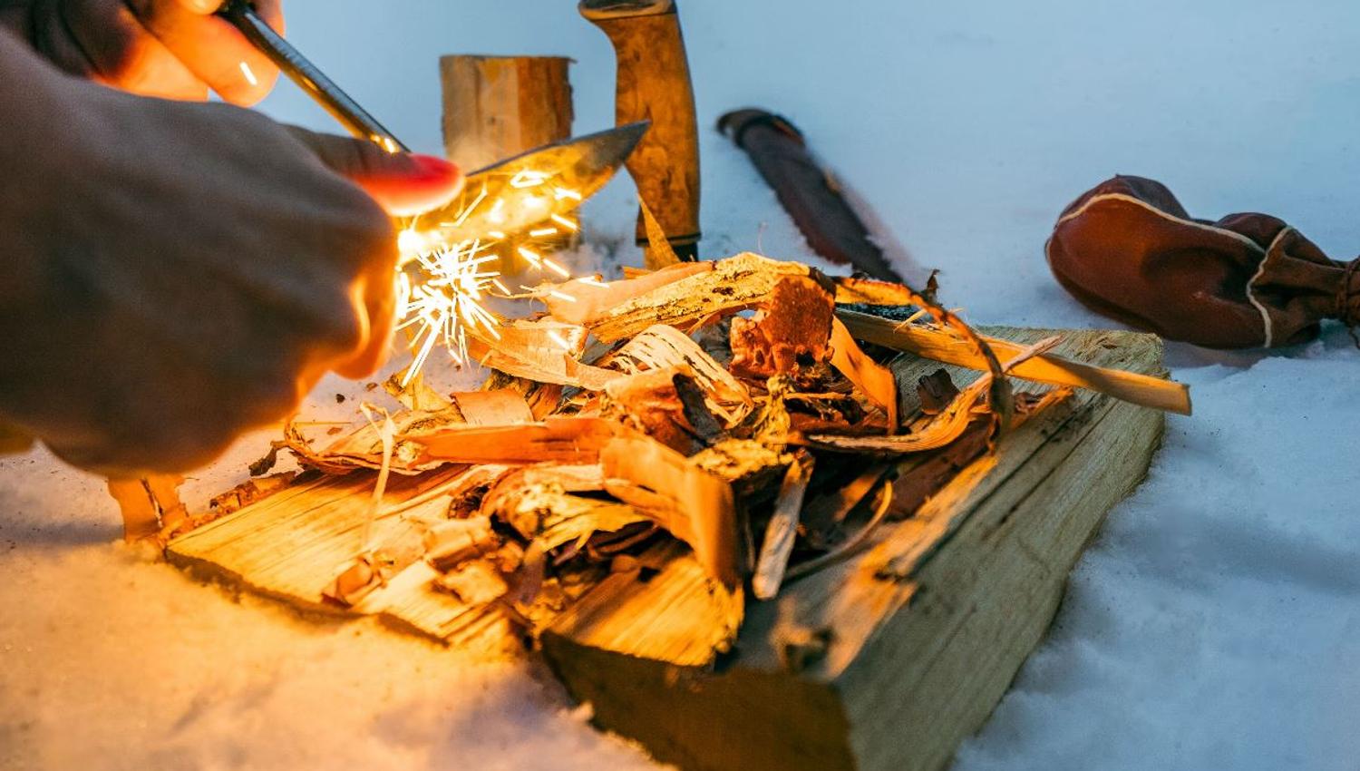 Demonstrating how to light the fire