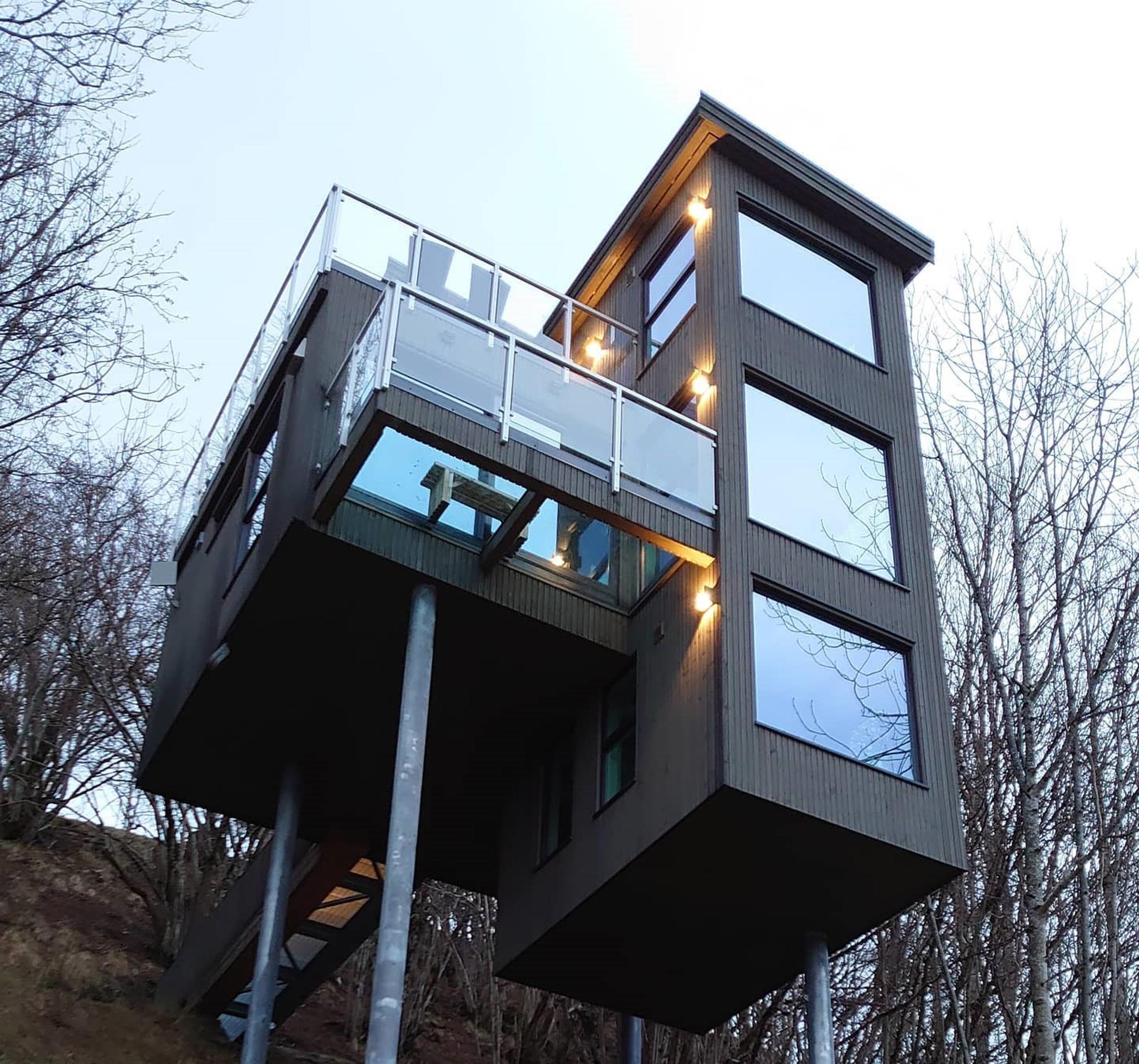 Modern cabin on stilts in the forest overlooking the fjord, Hardanger Panorama Lodge.