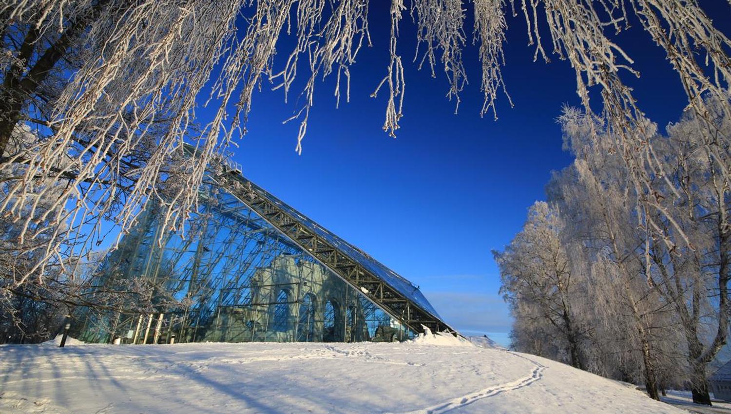 Ruins of domkirkeodden. Photo taken from the outside. Winter and blue sky.
