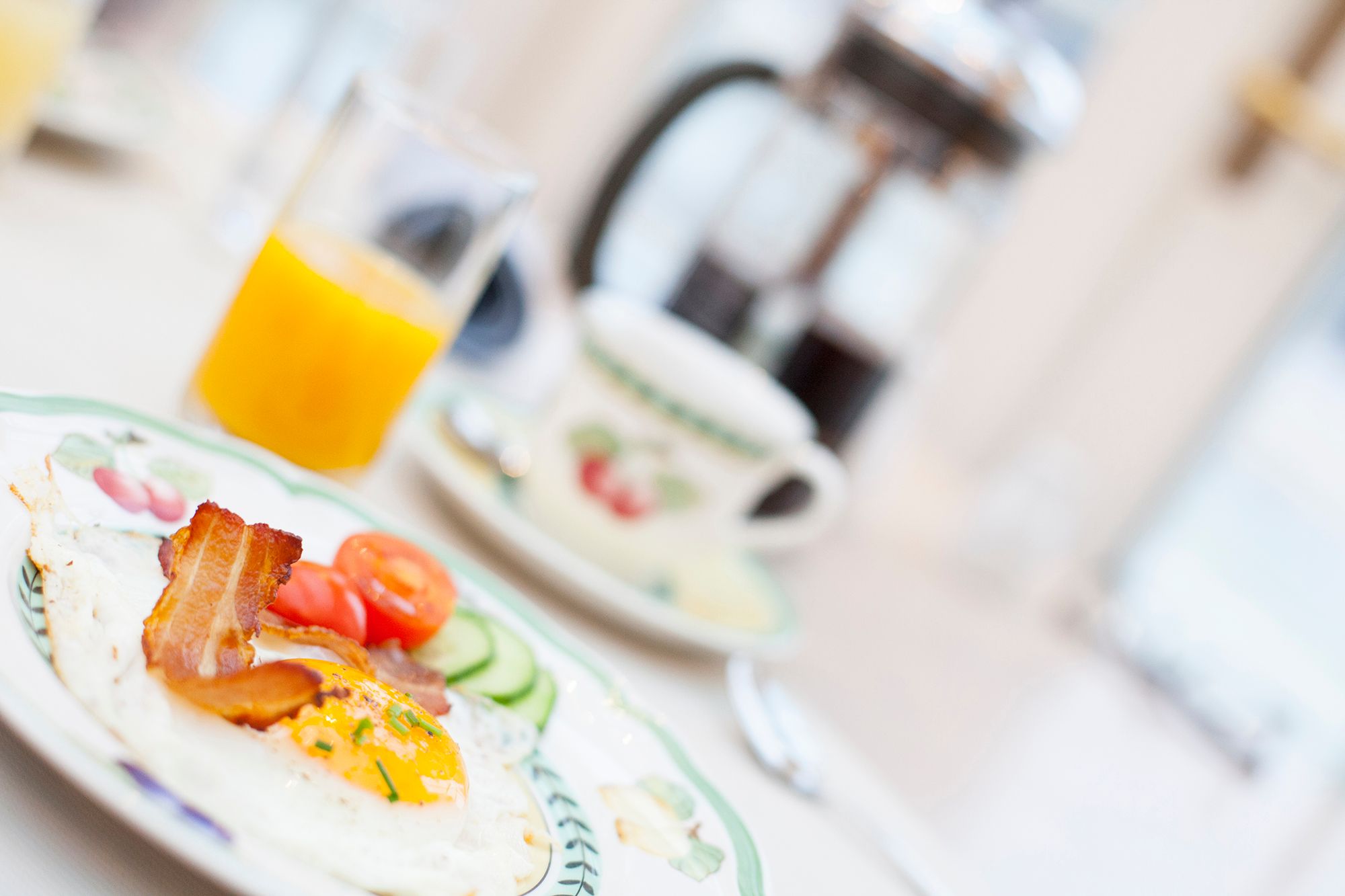 Breakfast on a plate and glass of juice