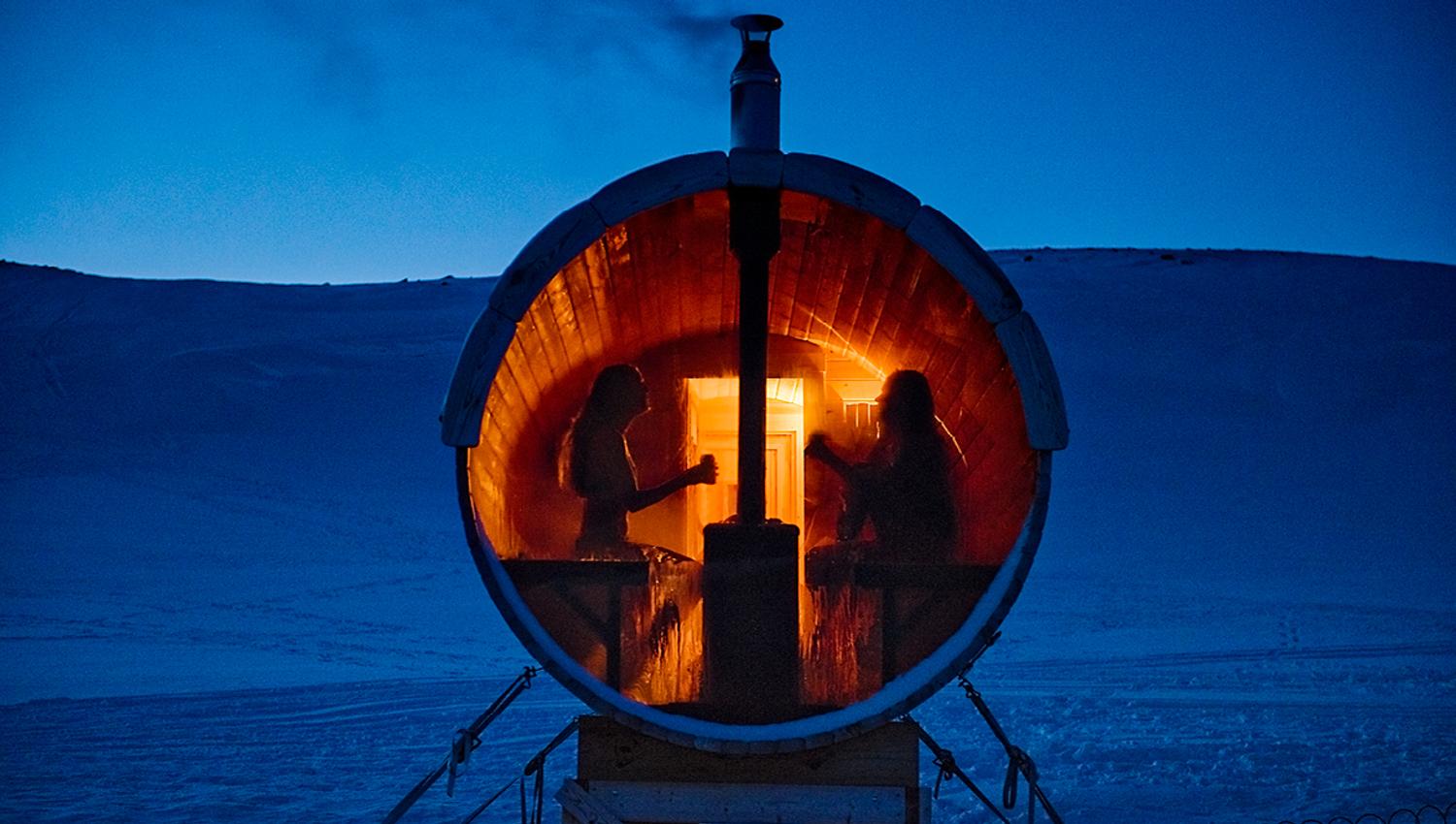 People enjoying a stay in the sauna in the evening