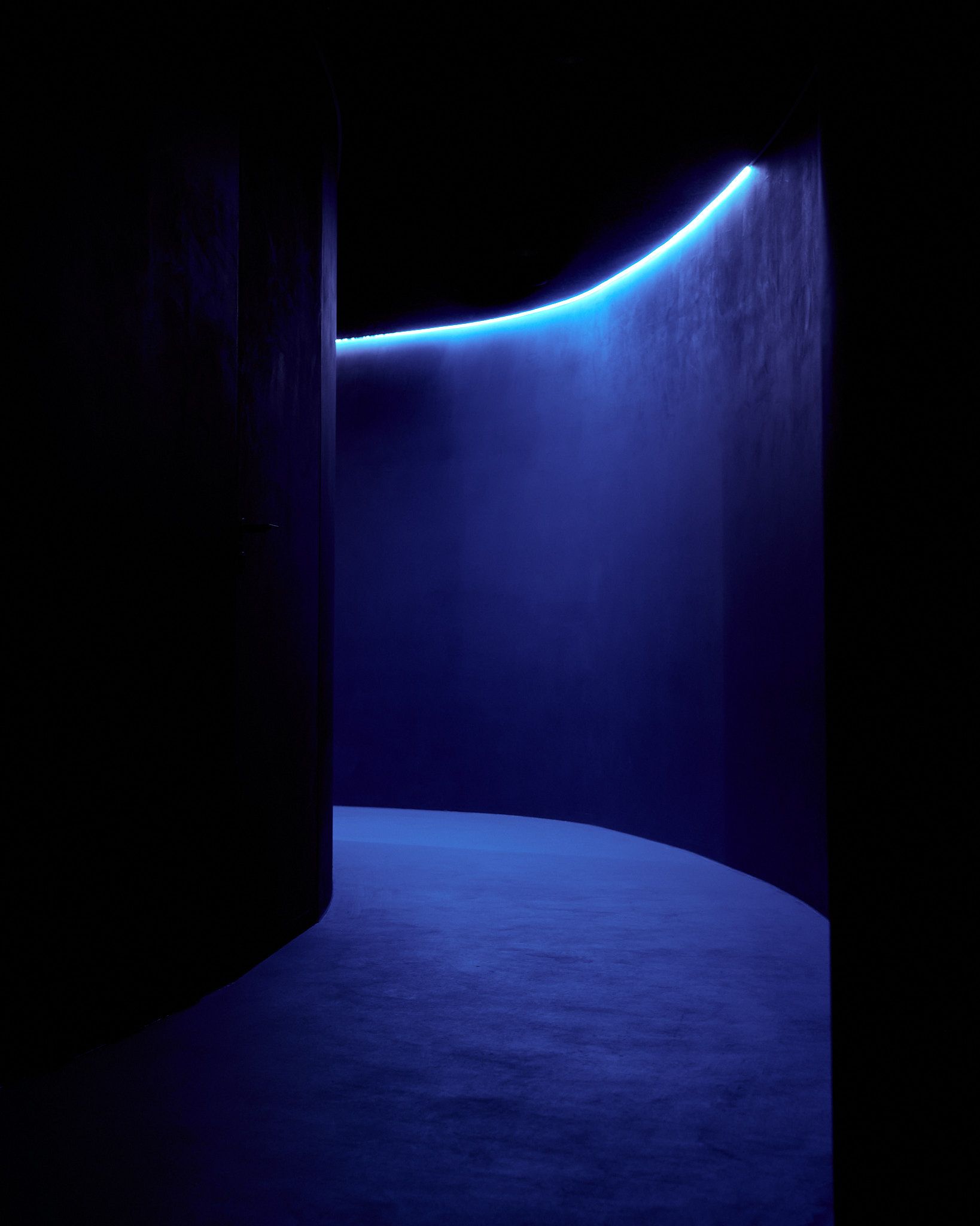 A dark hallway with blue lightening
