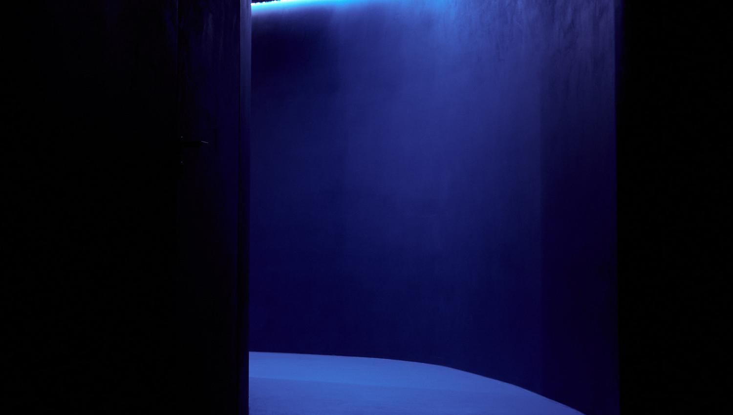 A dark hallway with blue lightening