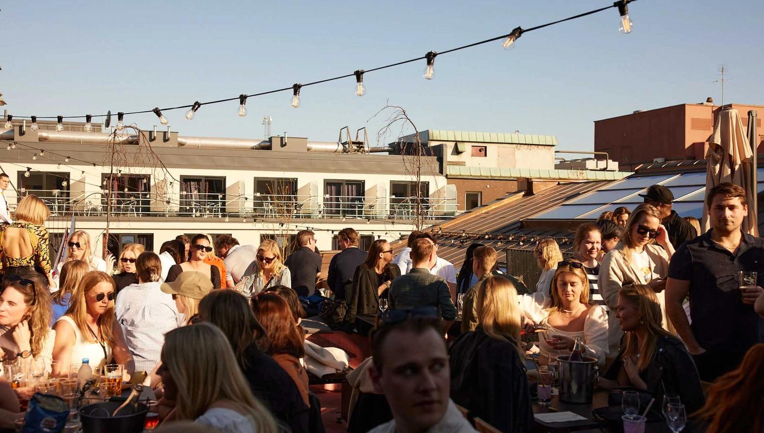 People drinking beer on the roof terrace