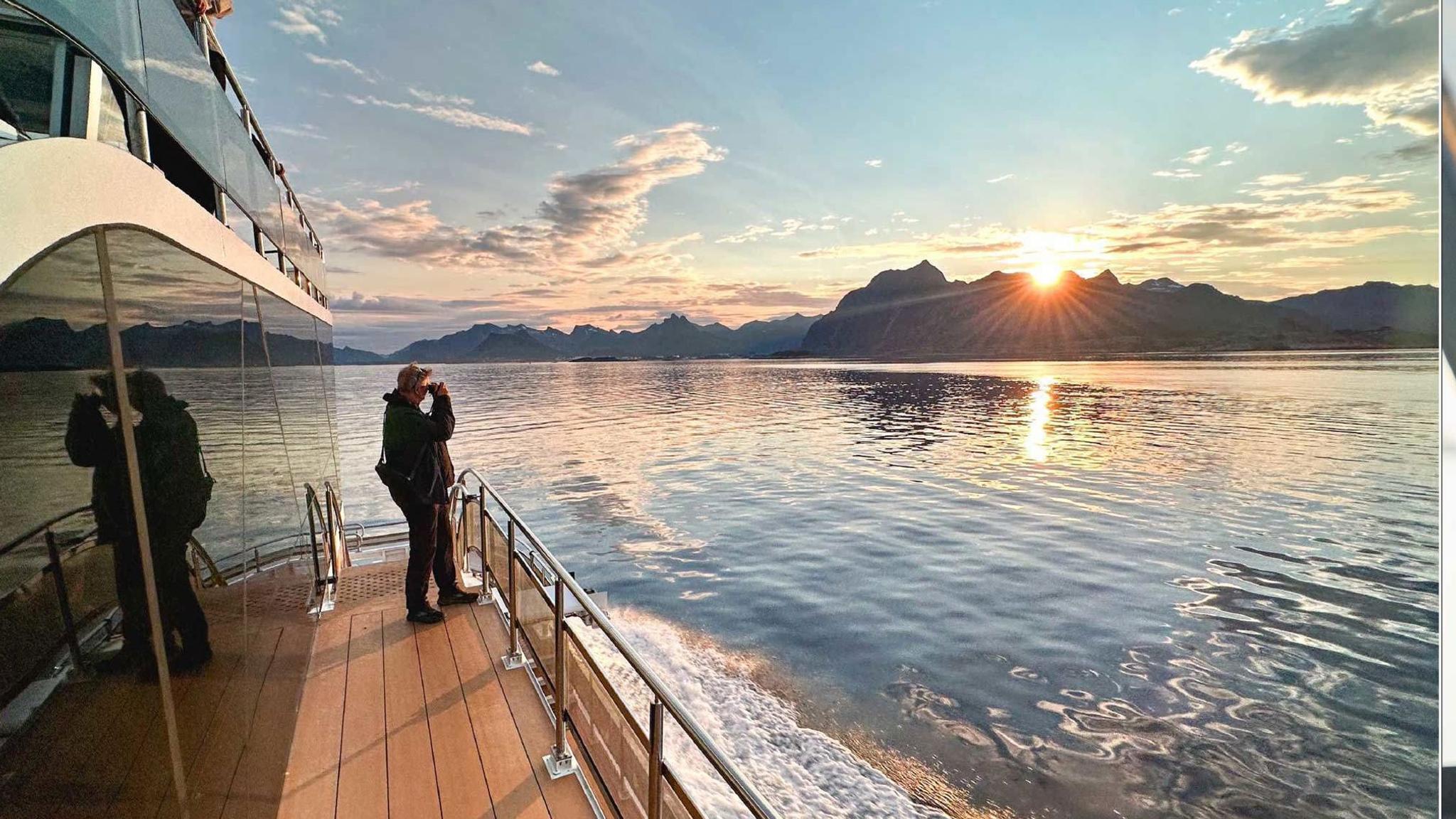 A guest looking at the midnight sun