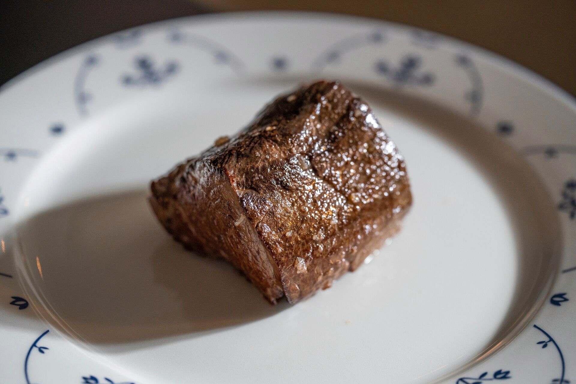 A piece of steak on a plate