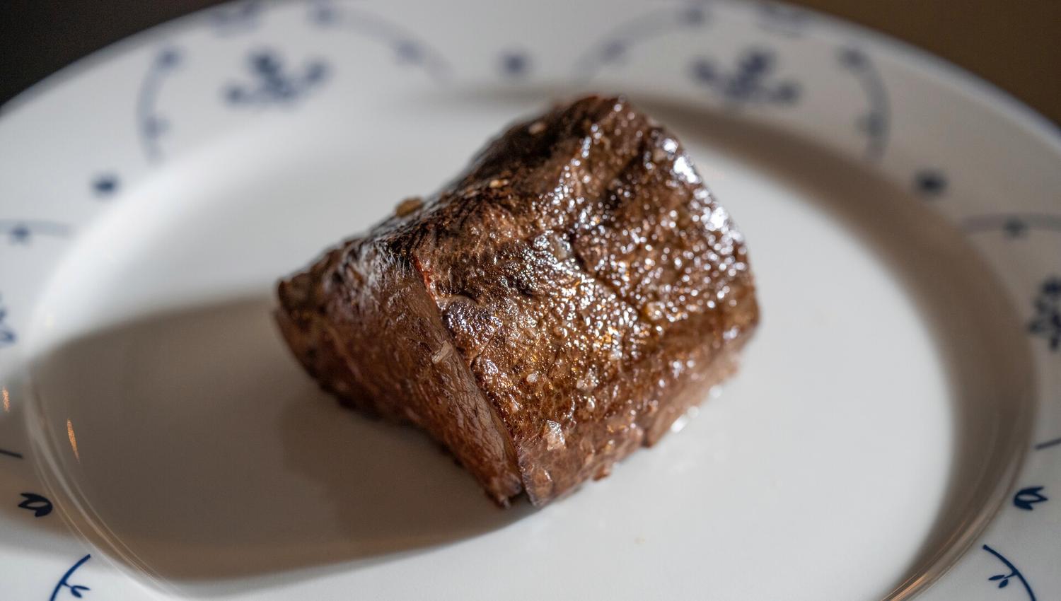 A piece of steak on a plate